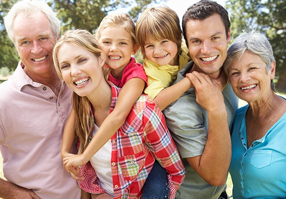 Three generations of family smiling together