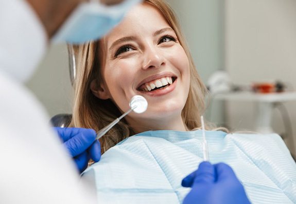 Patient smiles at dentist