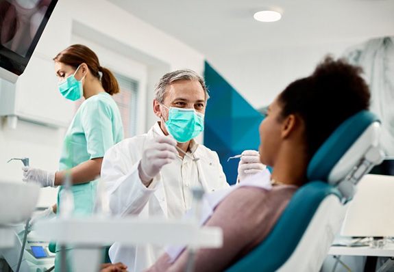 Dentist treats patient