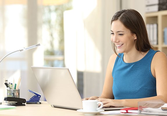 Woman scheduling appointment with a cosmetic dentist