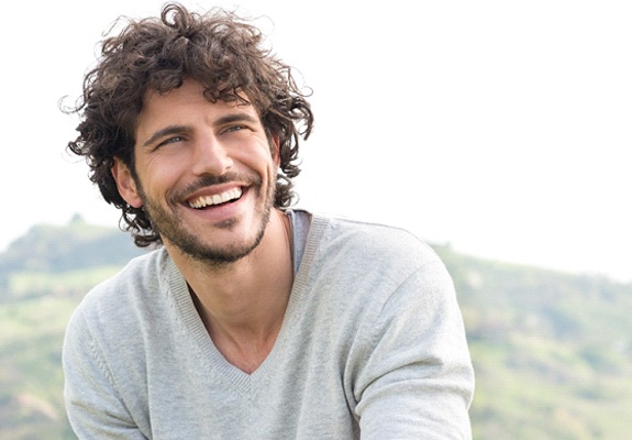 A young man smiling