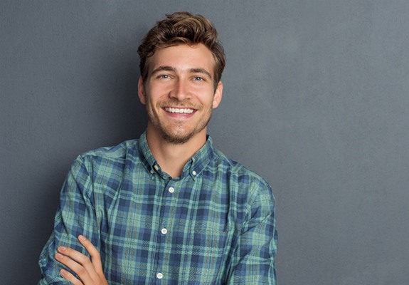 A young man smiling