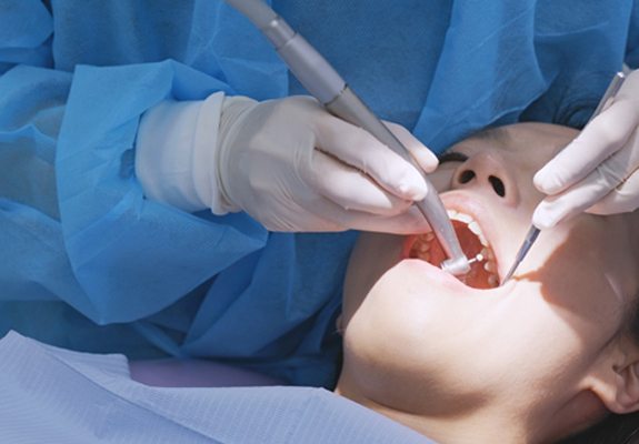 A woman having dental work performed