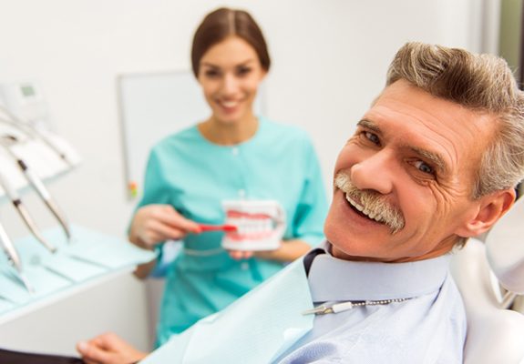 An older man in the dentist chair