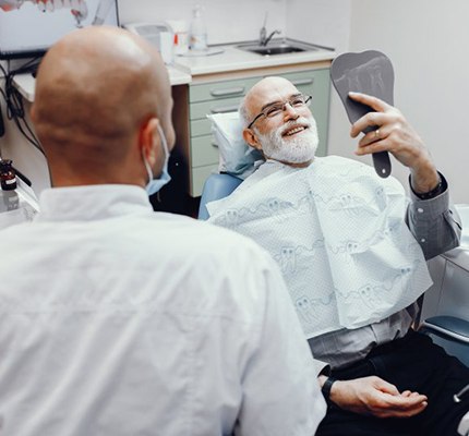 dentist discussing the cost of dentures in Fanwood with a patient 