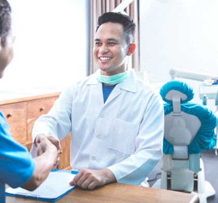 Patients shaking hands with emergency dentist in Fanwood