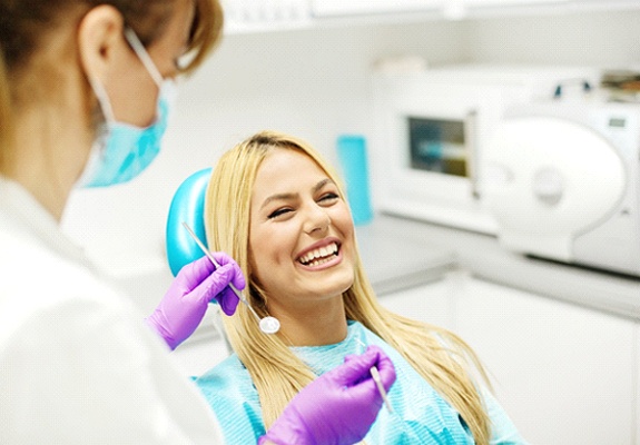 Smiling patient at dentist’s