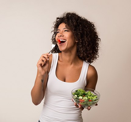 Woman eating salad in Fanwood