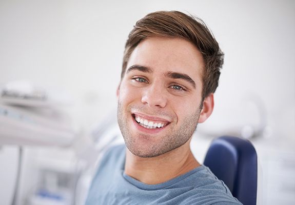 Smiling man in dental chair