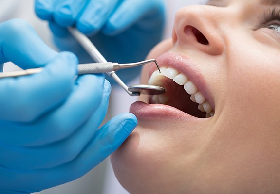 Woman receiving gum disease treatment