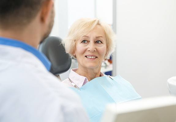 dentist explaining cost of root canal therapy