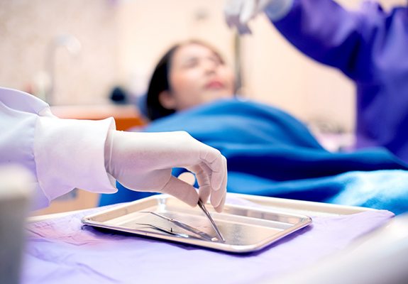 dentist performing extraction