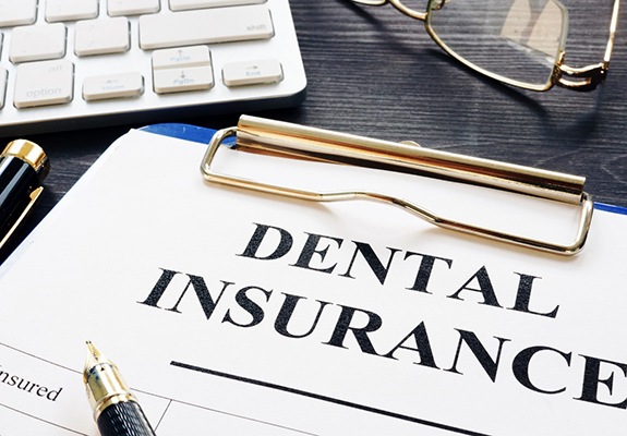 closeup of dental insurance form on table 