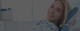 Smiling woman in dental chair