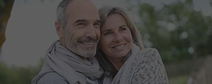 Smiling older man and woman outdoors