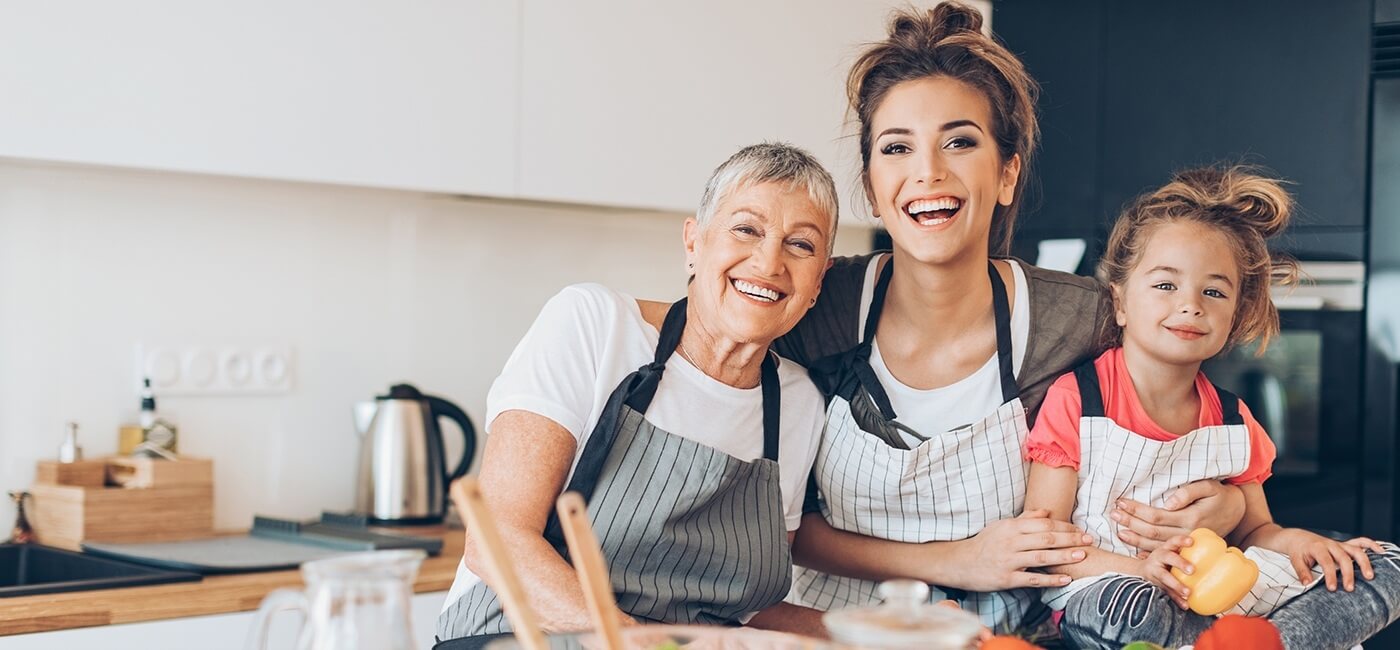 Three generations of women smiling together