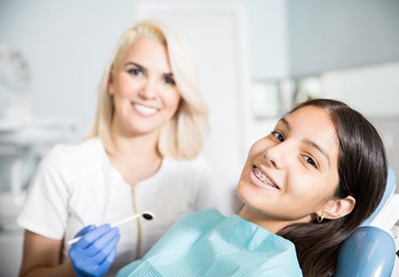 A young girl at the dentist office