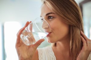 woman drinking glass of water