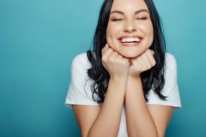 Woman smiling after receiving cosmetic dentistry.