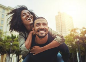 a happy couple showing their beautiful smiles