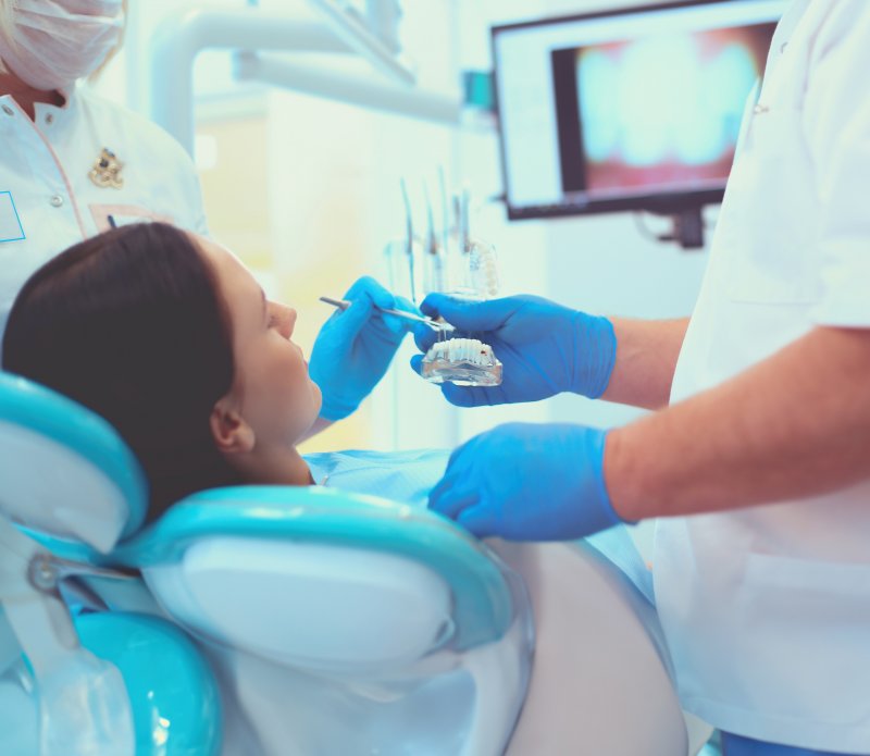 Dentist treats patient